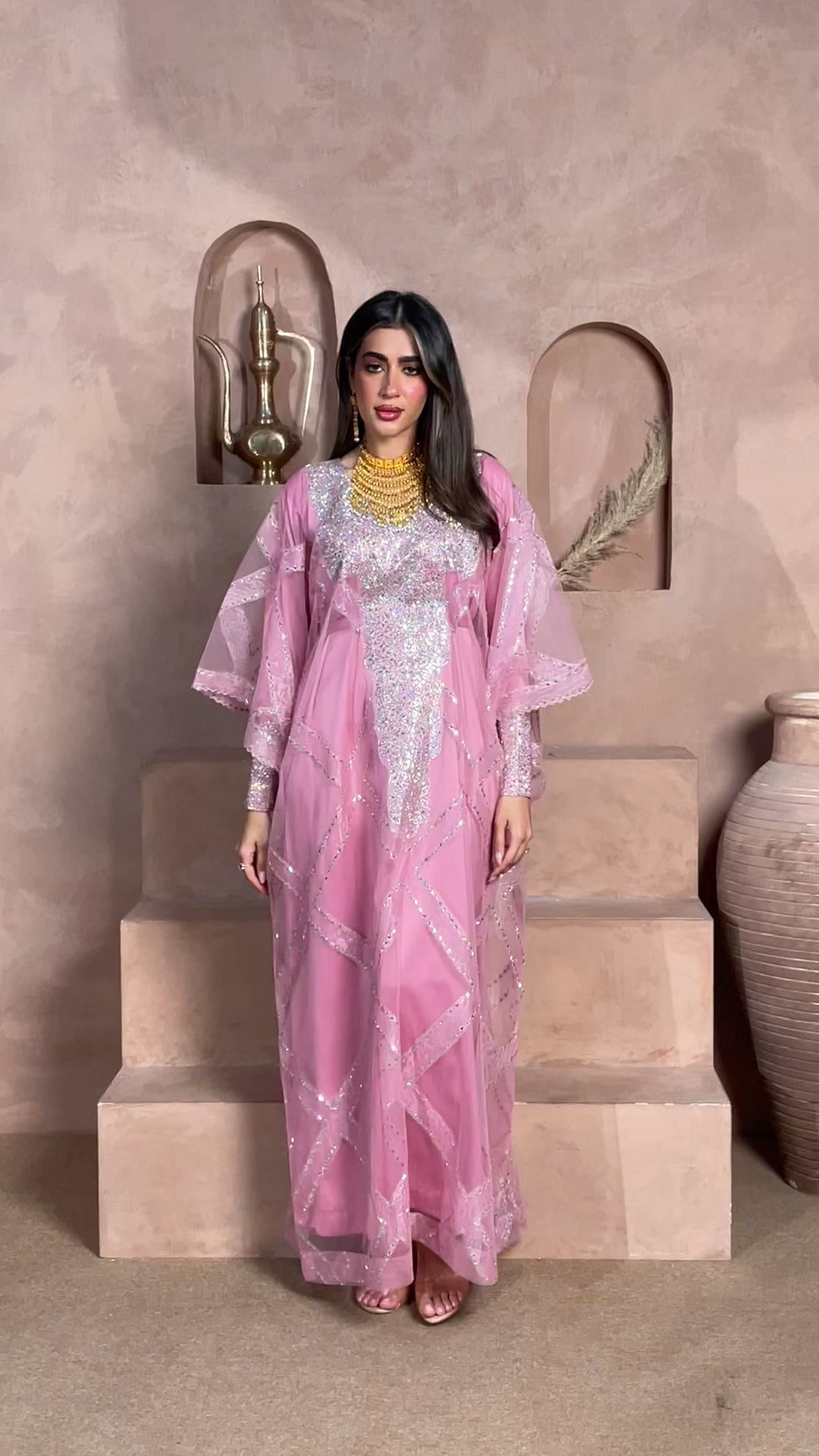 Blush pink luxury kaftan featuring crystal and silver embellishments with a sheer geometric-pattern overlay, perfect for Eid, weddings, receptions, and special occasions.